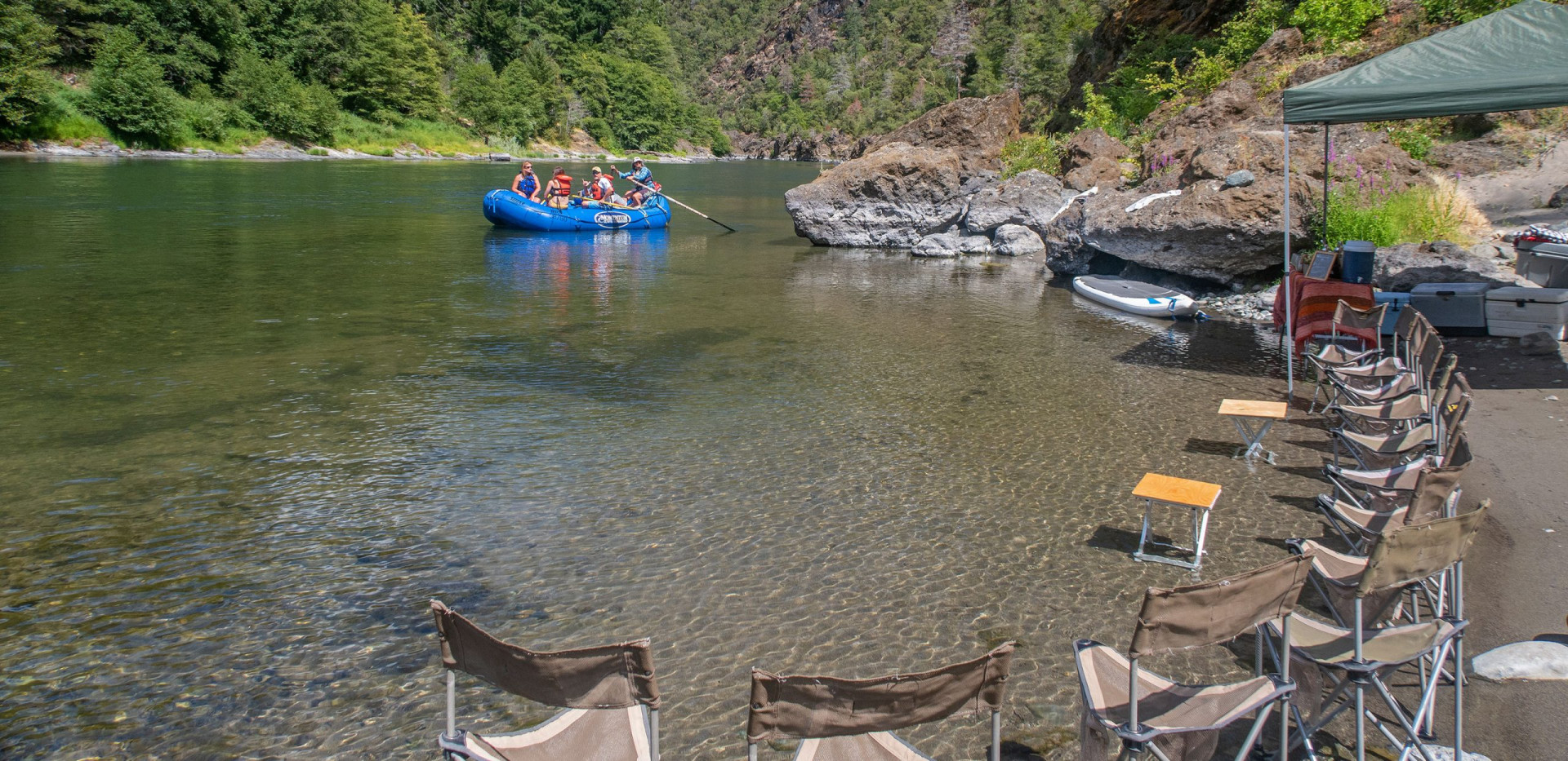 Floating into riverside camp - Luxury camping (glamping) rafting trips