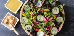Mixed Lettuces and Amaranth with White Miso Dressing - Wilderness Gourmet Rafting Trips - Photo: Wilder Projects
